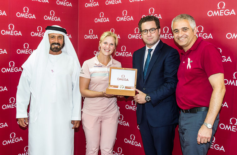 09/12/2016 Ladies European Tour 2016: Omega Dubai Ladies Masters, Emirates Golf Club, Dubai, UAE. 7-10 December. Minnea Blomqvist of Finland is presented with an Omega Watch having made a hole in one on the par 3 7th hole during the second round. Credit: Tristan Jones